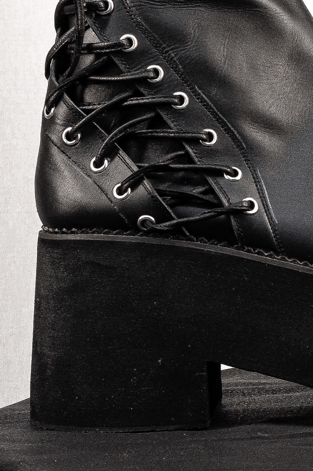 Close-up of the CRÜZØR PRAVAHA boot's hand-stitched welt above the high-density sponge platform sole